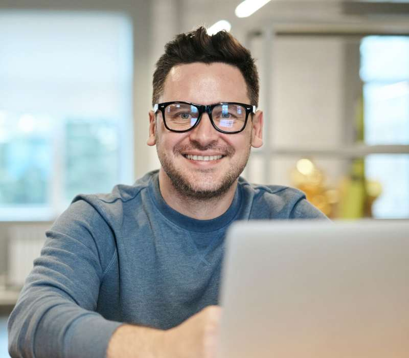 Man in front of laptop PC